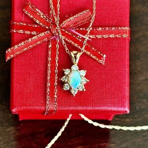 Opal and diamond necklace in 14k yellow gold